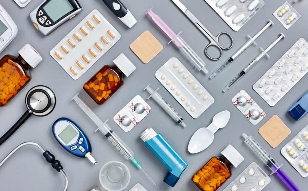 Flat-lay-of-various-medical-supplies-on-gray-background-624567292_2125x1416