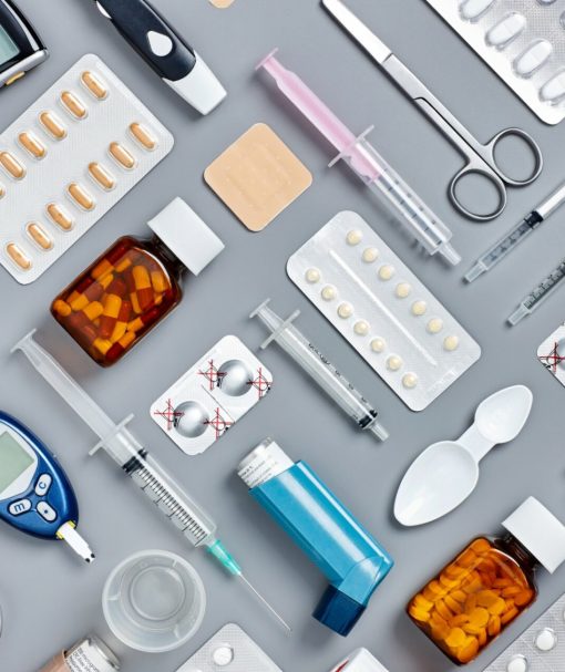 Flat-lay-of-various-medical-supplies-on-gray-background-624567292_2125x1416